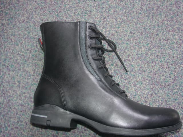 WOMENS HORSE RIDING BOOTS. COVERING THE ANKLE BUT NO PART OF THE CALF. UPPERS OF LEATHER. OUTER SOLES OF RUBBER. LACE UPS. WITH ZIP FASTENING DOWN THE BACK OF THE BOOT. INSOLE LENGTH MORE THAN 24CMS. BLACK IN COLOUR.