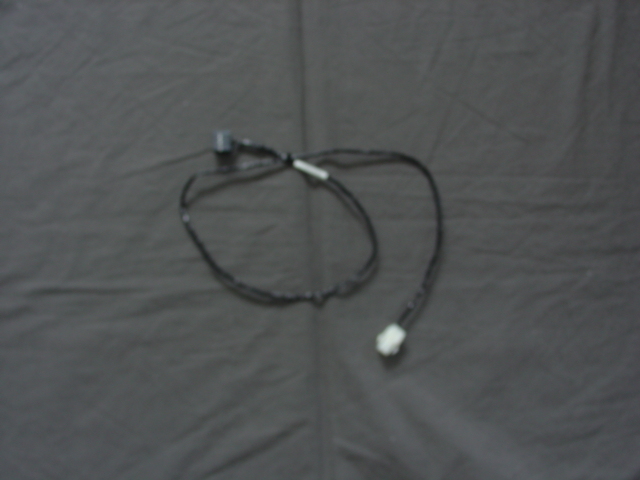 A WIRING HARNESS FOR A GAMING MACHINE. THE WIRES ARE APPROX 85 CM LONG WITH A WHITE PLASTIC CONNECTOR ON ONE END AND A BLACK CONNECTOR ON THE OTHER. DESIGNED FOR AND READY TO FIT INTO A GAMING MACHINE.