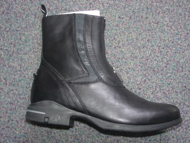 WOMENS HORSE RIDING BOOTS. COVERING THE ANKLE BUT NO PART OF THE CALF. UPPERS OF LEATHER. OUTER SOLES OF RUBBER. LACE UPS. WITH ZIP FASTENING. INSOLE LENGTH MORE THAN 24CMS. BLACK IN COLOUR.