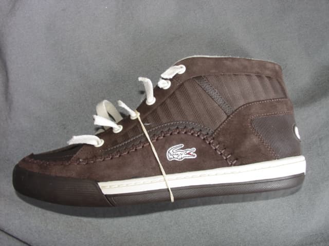 MENS BASKETBALL  ANKLE BOOT. COVERING THE ANKLE BUT NO PART OF THE CALF. UPPERS OF LEATHER, SUEDE LEATHER, RUBBER AND TEXTILE MATERIAL WHERE THE LEATHER PREDOMINATES. OUTER SOLES OF RUBBER/PLASTIC. WITH SPECIAL TECHNOLOGY IN THE FORM OF A THIN LAYER OF EVA IN THE HEEL DESIGNED TO ABSORB IMPACT OF VERTICAL OR LATERAL MOVEMENT. LACE FASTENING. WITH LOGO ON THE HEEL, TONGUE AND SIDE OF THE SHOE.  INSOLE LENGTH EXCEEDING 24CMS. CIF PRICE MORE THAN 7.5 EUROS. BROWN IN COLOUR.