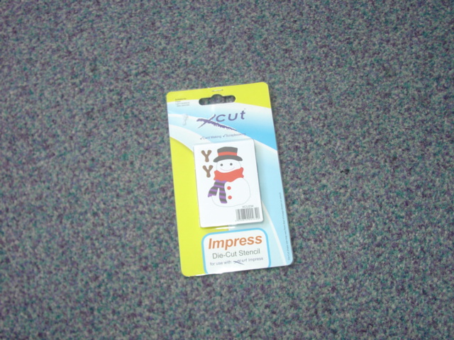 DIE-CUT STENCIL. WHICH CONTAINS A CUTTING BLADE. A SQUARE DESIGN WHICH YOU PLACE IN A MACHINE WITH YOUR CARD/PAPER ETC WHICH IS FED THROUGH. THE STENCIL CUTS A PERFECTLY CUT SHAPE. PACKAGED ON A CARD SLEEVE WITH PLASTIC SLEEVE FOR RETAIL SALE.