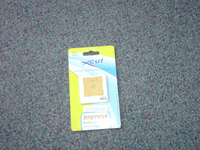 A PERFORATOR STENCIL WHICH CONTAINS A CUTTING BLADE. A SQUARE  DESIGN WHICH YOU PLACE IN A MACHINE WITH YOUR CARD/PAPER ETC WHICH IS FEED THROUGH. THE STENCIL CUTS PERFECTLY PERFORATED SHAPE READY TO EMBROIDER. PACKAGED ON A CARD SLEEVE WITH PLASTIC SLEEVE FOR RETAIL SALE.