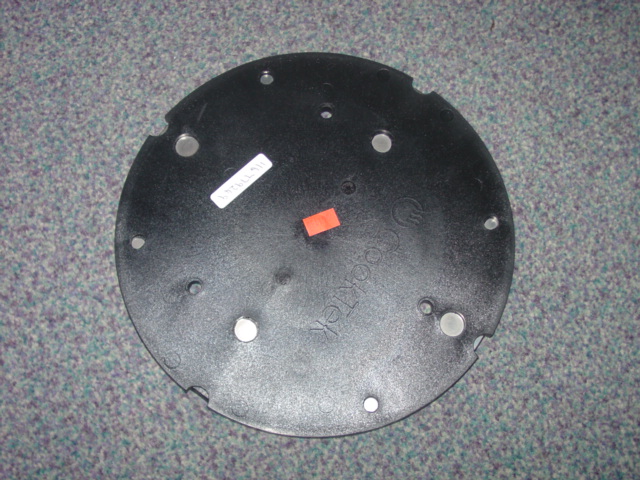 AN ELECTROMAGNETIC ENERGY PELLET. MADE UP OF A COPPER/NICKEL PLATE, NICKEL BEING THE MAJORITY WHICH HAS A PLASTIC CASING THE PELLET IS CHARGED AFTER EACH USE VIA HIGH FREQUENCY ALTERNATING MAGNETIC FIELD HEATING UP AND RETAINING THE HEAT. THE PELLET IS FLAT AND ROUND AND USED TO KEEP PIZZAS HOT FOR HOME DELIVERIES.