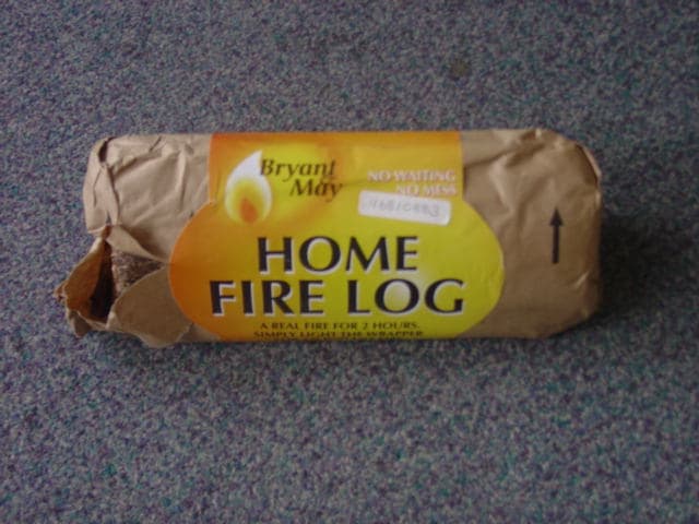 AN EXTRUDED WAX/WOOD LOG FOR WARMTH AND AMBIENCE AFTER A BARBECUE. THE LOG IS WRAPPED IN POLYETHYLENE COATED PAPER. EACH LOG IS QUADRANT SHAPED WITH A LENGTH OF 200MM AND A RADIUS OF 80MM, THE WRAPPER IS MADE OF BROWN KRAFT PAPER LAMINATED WITH POLYETHYLENE.