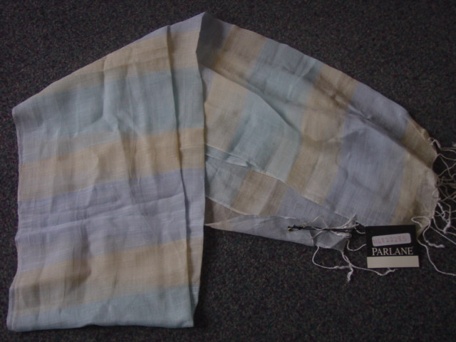 A WOVEN SCARF. WITH FRINGING AT SHORT ENDS. 50 PER CENT SILK, 50 PER CENT COTTON. 1800MM X 400 MM.