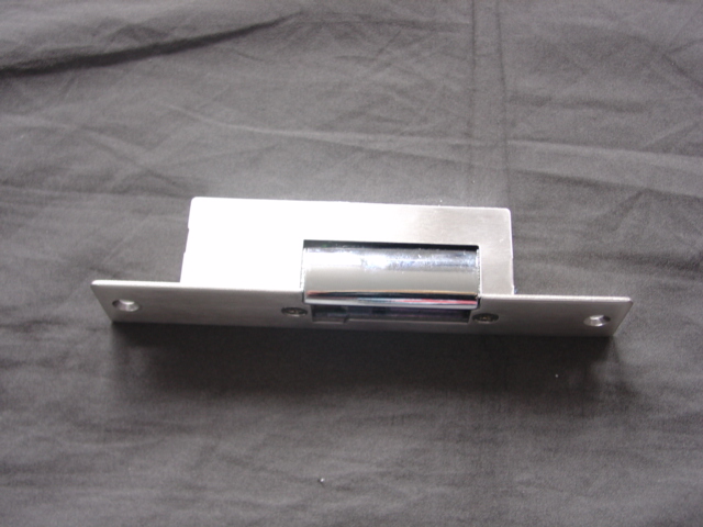 METAL ELECTRIC LOCK DESIGNED FOR USE AS PART OF A REMOTE CONTROL DOOR LOCKING SYSTEM. FOR USE IN BUILDINGS.