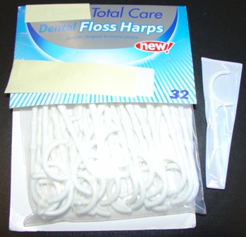 TOTAL CARE DENTAL FLOSS HARPS WHICH IS USED TO CLEAN BETWEEN THE TEETH, THE HANDLE IS MADE FROM ABS MATERIAL AND THE FLOSS IS MADE WITH NYLON. WHITE PLASTIC WITH MOULDED FINGER GRIP AND TAPERED TOOTH PICK AT THE END, AND IT IS THREE INCHES LONG.AND COMES IN A PACKET OF THIRTY TWO WITH A HANDY SOFT PLASTIC CARRIER INSIDE.THE FLOSS HARPS ARE CLEARLY VISIBLE IN A PLASTIC BAG STAPLED TO CARD.