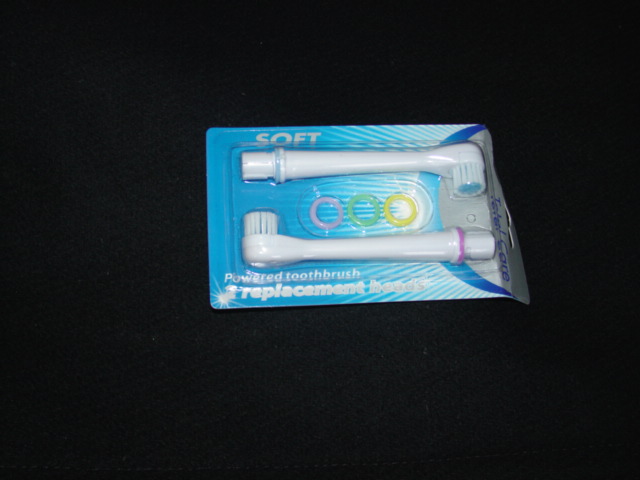 REPLACEMENT BRUSH HEADS FOR USE ON A POWERED TOOTHBRUSH. OF PLASTIC. BLISTER PACKED ON CARD