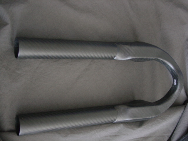 SHAPED SLIDER WHICH FORMS PART OF A BICYCLE FORK.  MADE OF CARBON FIBRE.