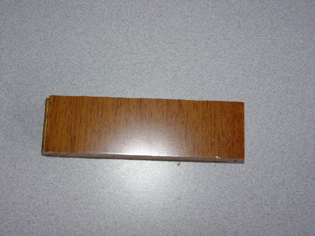 SOLID WOOD FLOORING PLANKS.  TONGUED AND GROOVED.  OF NON - CONIFEROUS TAUN WOOD.  PACKAGED TWELVE PIECES PER PACK IN A CARDBOARD BOX AND SHRINK WRAPPED ON WOODEN PALLETS.