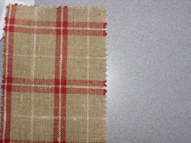 WOVEN PLAIN WEAVE FABRIC. OF 70 PERCENT VISCOSE STAPLE FIBRE AND 30 PERCENT COTTON. WEIGHING 350 GRAMS PER METRE SQUARED. YARNS OF DIFFERENT COLOURS. FINISHED WIDTH 142CM.