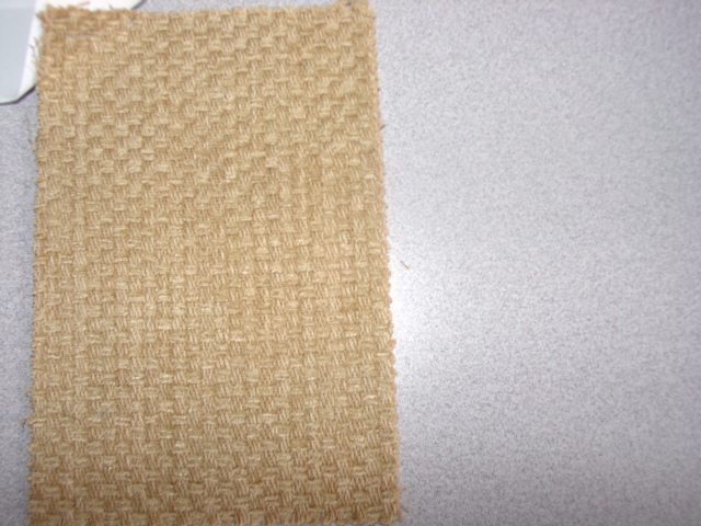 WOVEN CHENILLE PILE FABRIC. OF 66 PERCENT COTTON,  24 PERCENT VISCOSE AND 10 PERCENT POLYACRYLIC. WEIGHING 535 GRAMS PER METRE SQUARED. JACQUARD WEAVE. YARNS OF DIFFERENT COLOUR. FINISHED WIDTH 146CMS. MANUFACTURED ON A POWERLOOM.