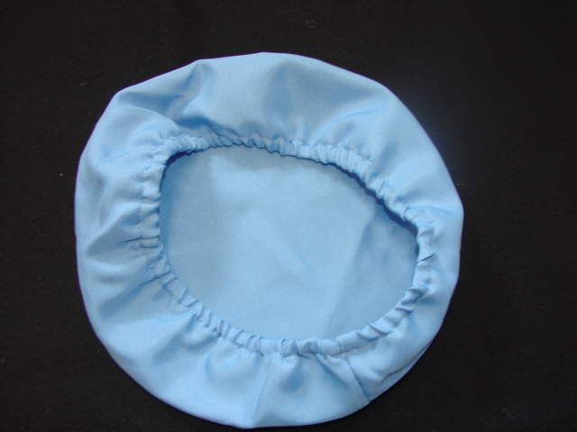 A WOVEN FANCY DRESS BERET STYLE HAT FOR CHILDREN.  ELASTICATED.  100 PERCENT POLYESTER.  PRESENTED WITH AN UPPER GARMENT, MASK, TROUSERS AND PLASTIC INSTRUMENTS, ALL CLASSIFIED SEPARATELY.