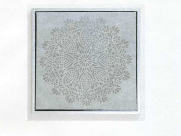 MADE UP DECORATIVE TEXTILE WALL HANGING. FURNISHING ARTICLE. TEXTILE FABRIC IS MOUNTED ON A WOODEN FRAME OVERLAID WITH A CONTRASTING NON-WOVEN TEXTILE WHICH HAS A DESIGN CUT INTO IT.  MEASURES 50 X 50 CMS. OF NYLON