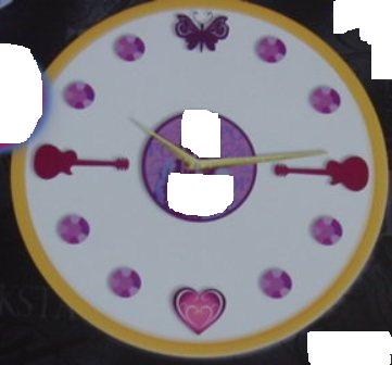 A DESIGN YOUR OWN SHAPE AND SIZE WALL CLOCK. THE CLOCK IS THE SAME SIZE AND SHAPE AS A STANDARD COMPACT DISK WITH A PICTURE OF A POPULAR TELEVISION CHARACTER PRINTED ON IT AND IS  BATTERY POWERED (BATTERY NOT INCLUDED) . THE CLOCK COMES WITH EIGHT PLASTIC  ROUND JEWEL SHAPES AND TWO GITUAR SHAPES, ONE BUTTERFLY AND A HEART SHAPE WHICH REPRESENT THE NUMERICAL ASPECT OF THE CLOCK. THESE  COME WITH DOUBLE SIDED STICKY PADS SO THAT YOU CAN DECIDE WHERE AND IN WHICH ORDER YOU WANT THE SHAPES AND JEWELS TO GO. THEN STICK THEM ON TO ANY SURFACE, THEREFORE YOU CAN DESIGN THE SHAPE OF YOUR CLOCK. THE COLOURS ARE MAUVE AND BLUE WITH GOLD HANDS ON THE CLOCK. COMES PACKAGED IN A CARDBOARD BOX 25CM X 25CM X 5CM WHICH HAS A TRANSPARENT CIRCLE IN THE FRONT SO THAT THE CLOCK IS VISIBLE.