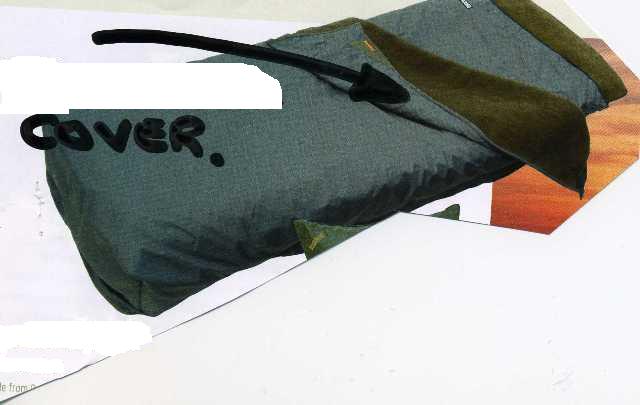 A WOVEN BLANKET LINED WITH KNITTED FLEECE. DESIGNED TO BE USED OVER A SLEEPING BAG TO PROVIDE EXTRA WARMTH. WITH SMALL HANDLES TO ATTACH THE BLANKET TO A CAMPING BED TO STOP IT FROM FALLING OFF. MADE FROM POLYESTER.