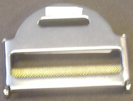 SEAT BELT ADJUSTER.  A BUCKLE FOR A SAFETY SEAT BELT FOR AUTOMOBILES. A WEBBING ADJUSTER COMMONLY USED ON LAP SEAT BELTS.  A MOULDED SHAPE MADE OF STEEL, SILVER IN COLOUR, 6 CENTIMETERS BY 4 CENTIMETERS. HAS A GOLD COLOURED TEXTURED ROLL BAR FITTED IN THE CENTER. FOR PERMANENT FIXTURE TO A CAR SAFETY BELT WHICH ALLOWS FOR THE ADJUSTMENT IN LENGTH OF THE BELT FOR USER COMFORT AND SAFETY.