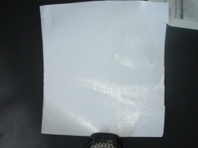 COATED, BLEACHED KRAFT PAPER WEIGHING 80 GM2 LAMINATED TO  A WOVEN POLYPROPYLENE BACKING WEIGHING 77 GM2 ON ONE SURFACE. THE THICKNESS OF THE POLYPROPYLENE IS LESS THAN HALF THAT OF THE PAPER. PRESENTED ON ROLLS OF VARIOUS WIDTHS.