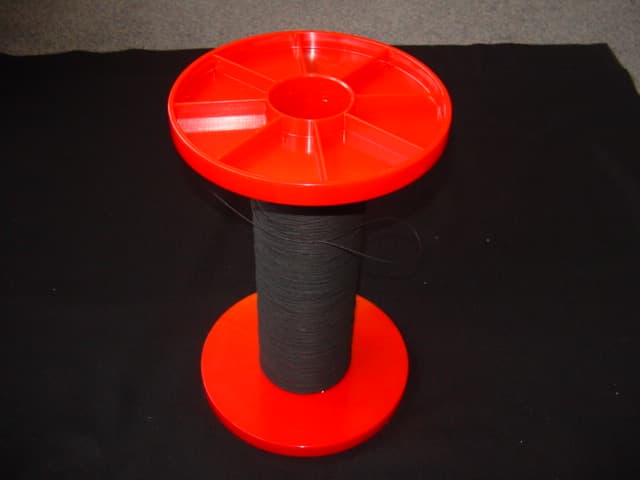 GLASS FIBRE CORD. YARN OF 34 TEX. PRODUCED BY TWISTING GLASS FIBRE FILAMENTS AND COATING THE TWISTED FILAMENTS WITH LATEX WHICH CONSISTS OF PHENOL-FORMALDEHYDE RESIN, VINYLPYDINE RESIN AND CHOLORSULPHONATED POLYETHYLENE. USED AS REINFORCEMENT MATERIAL OF TIMING BELTS INSTALLED IN DIESEL ENGINES. PACKAGED ON A PLASTIC BOBBIN. TWO BOBBINS PER CARTON.