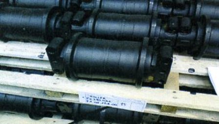 CAST STEEL ROLLERS WHICH ARE PART OF A MACHINE TRACK, TO BE FITTED TO A MINERAL CRUSHING MACHINE.  SPECIFICALLY SHAPED AND DESIGNED TO FIT A PARTICULAR MODEL.