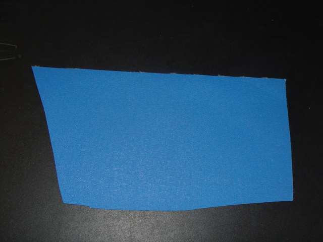 WOVEN TEXTILE FABRIC.  ON THE ROLL, LENGTH 45.7 MTS, WIDTH 157.5CMS. OF POLYESTER.  DYED BLUE IN COLOUR. MEDIUM TENACITY. WEIGHT 385.2GMS PER METRE SQUARED. SAID TO HAVE A POLYMERIC IMPREGNATION WITH A COATING WHICH IS NOT CONSIDERED TO BE VISIBLE TO THE NAKED EYE.  USED FOR THE MAKING OF MARINE COVERS