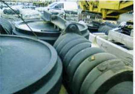 IDLERS, DESIGNED TO BE INSTALLED AT THE FRONT OF A CRUSHING MACHINE TRACK FRAME TO GUIDE THE TRACK LINK ASSEMBLY.  MADE FROM CAST STEEL THE IDLERS ARE SPECIFICALLY SHAPED AND DESIGNED TO FIT A PARTICULAR MODEL OF CRUSHING MACHINE.