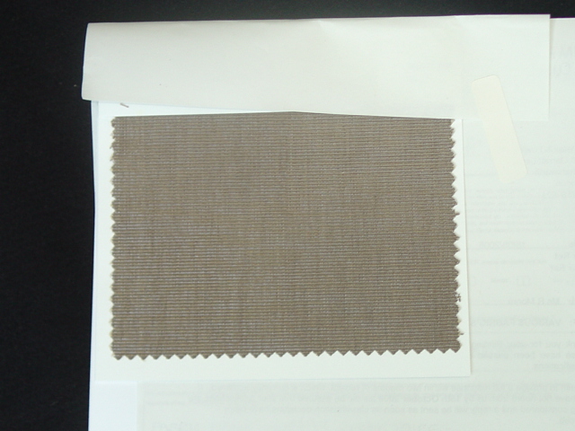 A JACQUARD WOVEN FABRIC OF YARNS OF TWO DIFFERENT COLOURS. WEIGHING 233 GM2. 52 PERCENT COTTON, 41 PERCENT VISCOSE AND 7 PERCENT NYLON.