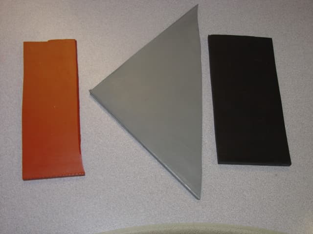 NON CELLULAR  BLACK RUBBER MATS. IMPORTED IN LARGE SHEET FORM AND THEN CUT TO SIZE TO FIT EACH MACHINE.MADE OF NEOPRENE RUBBER. 1/4 INCHES THICK, DUROMETER 60D. DIMENSIONS 940X 76 X 6.35. .
