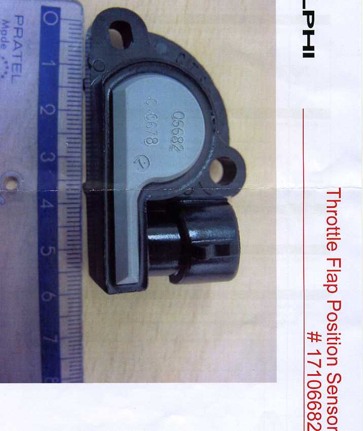 THROTTLE FLAP POSITION SENSOR (TFPS). IT IS A POTENTIOMETER, CONTAINING A VARIABLE RESISTOR  AND RESISTOR WIPER, ELECTRICAL CONTACTS (TERMINALS), SENSOR ARM AND HOUSING. IT IS FOR USE IN A MOTOR VEHICLE, WHEREBY IT IS ATTACHED BY ITS SENSOR ARM TO THE ENGINE THROTTLE FLAP COMPONENT OF THE ENGINE THROTTLE VALVE. THE THROTTLE VALVE, BY MEANS OF THE MECHANICAL MOVEMENT OF ITS THROTTLE FLAP, METERS THE AMOUNT OF AIR FLOWING INTO THE ENGINE MANIFOLD. THE SENSOR ARM IS ATTACHED TO THE THROTTLE FLAP AT ONE END, AND THE POTENTIOMETER'S WIPER ON THE OTHER. THE CHANGE IN THE POSITION OF THE WIPER CAUSES A CHANGE IN THE RESISTENCE WITHIN THE POTENTIOMETER WHICH IS EQUAL TO AND TRANSMITTED AS A VOLTAGE SIGNAL OUTPUT TO THE ENGINE CONTROL MODULE (ECM). THE TFPS OUTPUT SIGNAL SERVES AN AN INPUT SIGNAL TO THE ECM, WHICH THE ECM ANALYSES AND MEASURES TO DETERMINE THE POSITION OF THE THROTTLE. THE TFPS ACCOMPLISHIES THIS BY TRANSLATING MECHANICAL OPERATION OF THE THROTTLE FLAP INTO ELECTRICAL SIGNALS BY MEANS OF A POTENTIOMETER.
