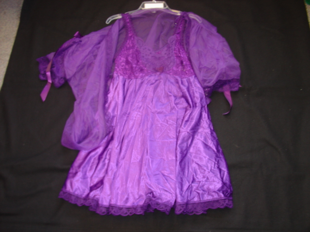 KNITTED BABY DOLL PYJAMAS FOR WOMEN.  WITH UPPER GARMENT REACHING DOWN TO BELOW THE HIPS.  THE UPPER BODICE IS CONSTRUCTED OF KNITTED STRETCH LACE STYLE FABRIC EXTENDING INTO A FULL OPAQUE TRICOT KNIT SKIRT WITH LACE TRIM AT BASE AND RIBBON ROSE BOW AT CENTRE FRONT.  WITH ADJUSTABLE SHOULDER STRAPS.  WITH MATCHING G-STRING BRIEF.  100 PERCENT NYLON. PACKED ON PLASTIC HANGER WITH DRESSING GOWN CLASSIFIED SEPARATELY IN CASE 117884347