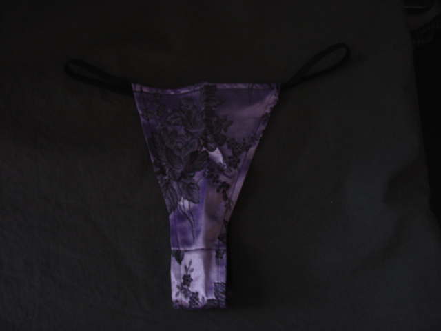 A WOMEN'S 65% COTTON, 35% POLYESTER WOVEN G-STRING. PACKAGED TOGETHER ON A HANGER WITH A MATCHING STRAPLESS CORSET, CLASSIFIED SEPARATELY.
