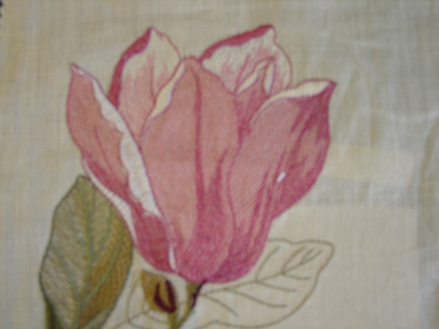 EMBROIDERED WOVEN FABRIC. WITH VISIBLE GROUND. WITH MACHINE EMBOIDERED DESIGN IN FLOWERS AND LEAVES, PINK AND GREEN ON A NATURAL COLOURED GROUND FABRIC. WIDTH 124CM. DESIGN REPEAT 79CM. DRY CLEAN ONLY. OF 75 PER CENT LINEN 25 PER CENT VISCOSE. OF A VALUE EXCEEDING 17.5 EURO PER KG (NET WEIGHT).
