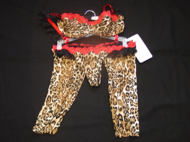 A WOMANS LEOPARD PRINT THONG EDGED WITH LACE. PACKAGED TOGETHER FOR RETAIL SALE WITH A MATCHING BRA AND STOCKINGS WHICH HAVE BEEN CLASSIFIED SEPARATELY. PRESENTED ON A HANGER.