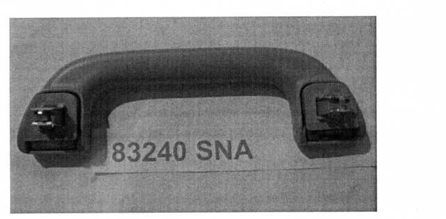 GRAB RAIL ASSEMBLY. THE PART IS USED IN THE INDUSTRIAL ASSEMBLY OF VEHICLES CLASSIFIED TO TARIFF HEADING 8703. THE GRAB RAIL ASSEMBLY IS AFFIXED TO THE INSIDE BODY OF THE VEHICLE ABOVE EACH WINDOW. THE PART IS MANUFACTURED FROM PLASTIC AND IS ATTACHED TO THE BODY OF THE VEHICLE BY METAL CLIPS WHICH ARE MOUNTED ONTO A SPRUNG BASE,  ALLOWING THE ANGLE OF THE GRAB RAIL TO MOVE. THE GRAB RAIL IS DESIGNED TO BE FITTED INTO SPECIFIC VEHICLE MODELS TO PROVIDE STABILITY AND SUPPORT FOR THE PASSENGERS AND DRIVER OF THE VEHICLE.