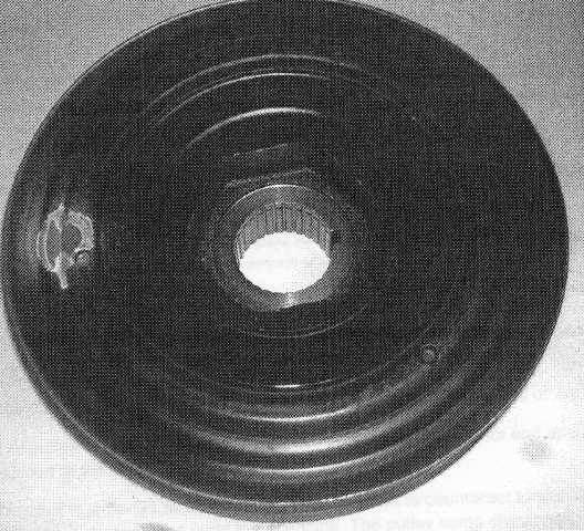 PULLEY COMPONENT CRANKSHAFT. THE PULLEY COMP CRANKSHAFT IS A CRANK PULLEY DAMPENER WHICH SITS AT THE FRONT OF THE CRANKSHAFT IN THE ENGINE. THE PART IS IMPORTED FOR THE INDUSTRIAL ASSEMBLY OF MOTOR VEHICLES OF TARIFF HEADING 8703. THE PULLEY COMP CRANKSHAFT IS A DISC COMPRISING A STEEL EXTERIOR AND AN INNER BUSHING OF VULCANISED RUBBER BONDED TO THE STEEL. THE PART IS IMPORTED AS A SINGLE UNIT. IT IS  DESIGNED TO COUNTERACT TORSIONAL VIBRATION IN THE CRANKSHAFT, THEBY PREVENTING DAMAGE AND WEAR TO THE ENGINE. THE PULLEY COMP CRANKSHAFT RESISTS THE ACCELERATION OF VIBRATIONS IN THE CRANKSHAFT AND DISSIPATES THIS ENERGY THROUGH THE RUBBER SECTION.