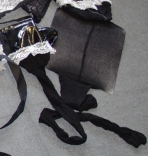 KNITTED FULL LENGTH SHEER STOCKINGS FOR WOMEN.  MEASURING LESS THAN 67 DECITEX.  OF NYLON. PARTIALLY COATED WITH PLASTIC AT TOP WITH BOW AND LACE STYLE TRIM DECORATION. PACKED IN A PLASTIC BAG WITH OTHER GARMENT, STOCKINGS AND MOCK CAP ALL CLASSIFIED SEPARATELY IN CASES 117806471, 117921375 AND 117921571