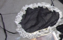 HEADGEAR. KNITTED CIRCULAR MESH MOCK CAP.  WITH LACE STYLE TRIM AROUND EDGE.  WITH RIBBON TIES. OF NYLON. PACKED IN A PLASTIC BAG WITH OTHER GARMENT, STOCKINGS AND BRIEFS ALL CLASSIFIED SEPARATELY IN CASES 117806471, 117921375 AND 117921473