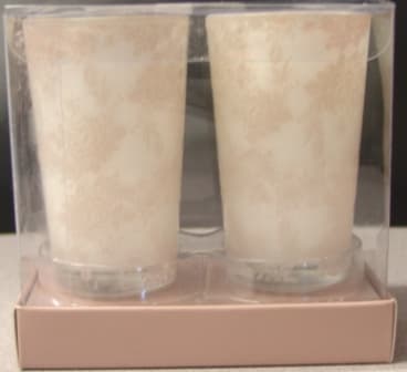 A SET OF TWO PLAIN, NOT PERFUMED WAX CANDLES THAT ARE MOULDED INTO ROUND GLASS POTS, 8.5 CENTIMETERS HIGH, WITH A DIAMETER OF 5 CENTIMETERS. THE POTS ARE OPAQUE GLASS DECORATED WITH A FLORAL DESIGN. COMES PACKAGED FOR RETAIL SALE IN A TRANSPARENT PLASTIC BOX WITH CARDBOARD BASE, 10 CENTRMETRES BY 11 CENTIMETRES BY 6 CENTIMETRES.