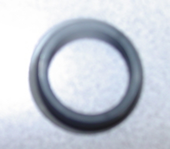 AN AUTOMOTIVE GEARBOX SEAL FILTER MADE OF RUBBER WITH A METAL RING INSERT.