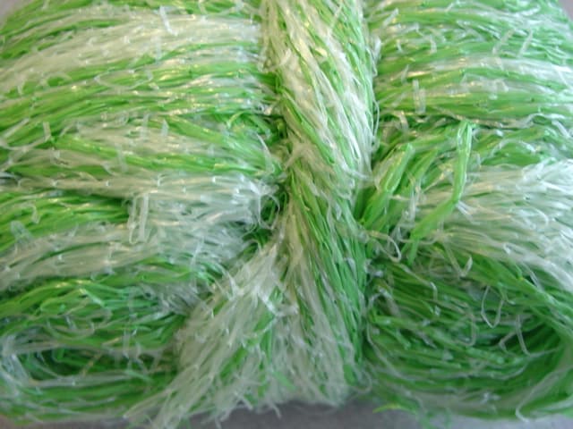 KNITTED 100 PERCENT POLYETHYLENE NETTING. WITH DIFFERENT COLOURED YARNS. FOR TYING AGRICULTURAL BALES IN CONJUNCTION WITH A ROUND BALER MACHINE.WIDTH 122 CM ROLLED ONTO A CARDBOARD CORE TO MAKE A ROLL OF 2000 TO 4500 LINEAR METERS OF MATERIAL.