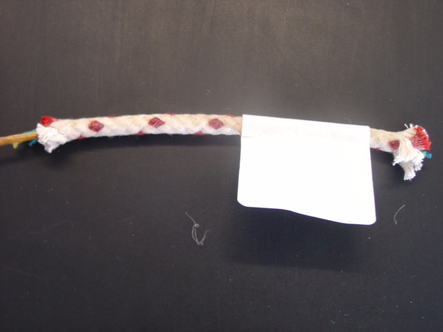 6.5MM WAXED COTTON PLAITED CORD. WITH A CENTRE CORE OF VARIOUS COLOURED FOLDED STRIPS OF SYNTHETIC PLASTIC.  DECITEX 256,000