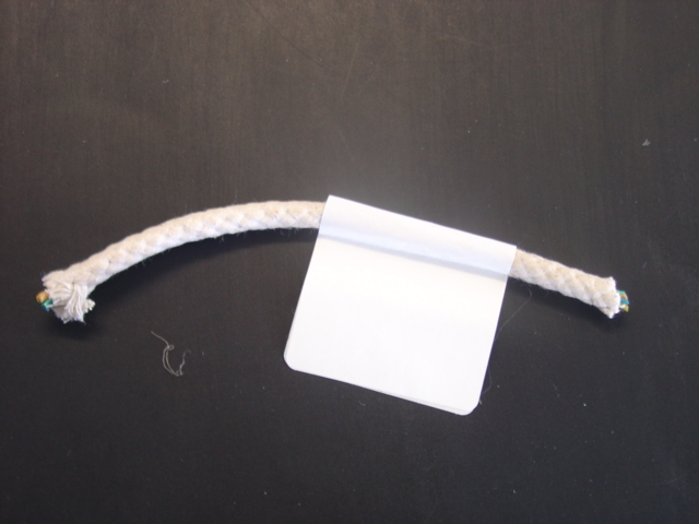 6MM WAXED COTTON PLAITED PULLEY CORD. WITH A CENTRE CORE OF VARIOUS COLOURED FOLDED STRIPS OF SYNTHETIC PLASTIC.  DECITEX 203,000