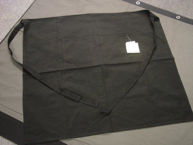 WOVEN BAR APRON FOR UNISEX.  REACHING FROM THE WAIST TO BELOW THE KNEE.  HEMMED ON ALL EDGES. WITH SELF FABRIC TIES AT THE WAIST.  WITH TWO POCKETS ON CENTRE FRONT. OF COTTON TWILL