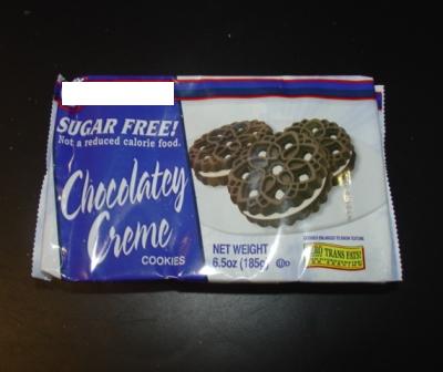 SUGAR FREE CHOCOLATE CREAM COOKIES.  COOKIES ARE MADE UP OF TWO CIRCULAR CHOCOLATE FLAVOURED BISCUITS SANDWICHED WITH A CREAM FILLING.  THE CHOCOLATE BISCUITS HAVE HOLES IN THEM SHOWING THE FILLING UNDERNEATH.  SUPPLIED IN PACKS WEIGHING 185G.  INGREDIENTS: ENRICHED WHEAT FLOUR, VEGETABLE OIL, MALTITOL, SORBITOL, COCOA, WHEAT DEXTRIN, WHEY, MALTODEXTRIN, CORN STARCH, SALT, NATURAL AND ARTIFICIAL FLAVOURS, EGGS AND SOY LECITHIN.