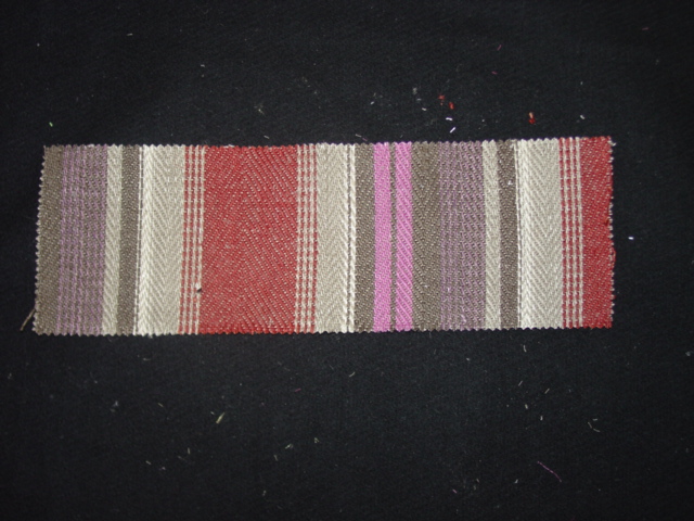 WOVEN FABRIC IN THE PIECE. OF 71 PER CENT LINEN AND 29 PER CENT JUTE. WEIGHING 530 GRAMS PER METRE SQUARED. WIDTH OF 135CM. YARNS OF DIFFERENT COLOURS. WOVEN ON A DOBBY LOOM.