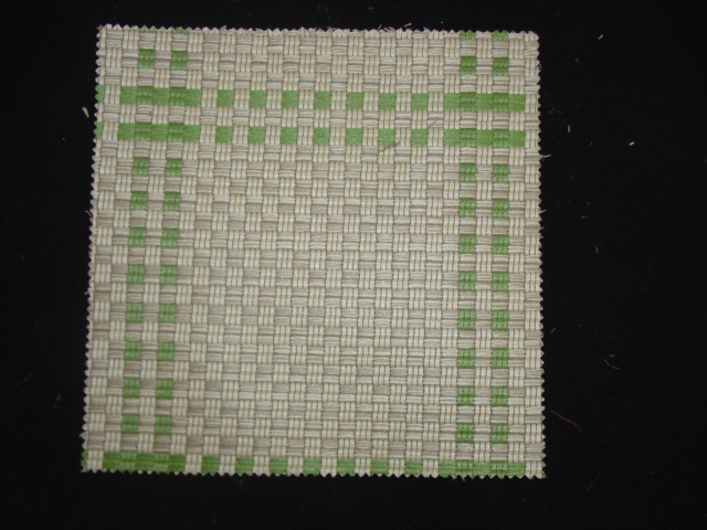 A WOVEN FABRIC OF 100 PER CENT ACRYLIC STAPLE FIBRES. WEIGHING 525 GRAMS PER METRE SQUARE. WIDTH OF 145CM. WOVEN ON A JACQUARD LOOM. OF YARNS OF DIFFERENT COLOURS.