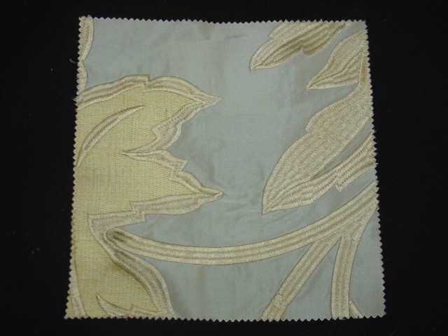 AUTOMATIC DOBBY LOOM WOVEN FABRIC  WITH EMBROIDERED  DESIGN ON A VISIBLE BACKGROUND. WITH A WIDTH OF 132CMS. WITH A VALUE EXCEEDING 17.5 EUROS PER KG. WITH BASE CLOTH OF 100 PER CENT SILK, EMBROIDERED WITH VISCOSE.