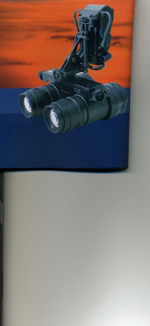 A PAIR OF NIGHT VISION BINOCULARS. EACH IMAGE INTENSIFIER TUBE IS POWERED INDEPENDENTLY BY SEPARATE BATTERIES AND ELECTRICAL CIRCUITS. FOR MOUNTING TO A HELMET.