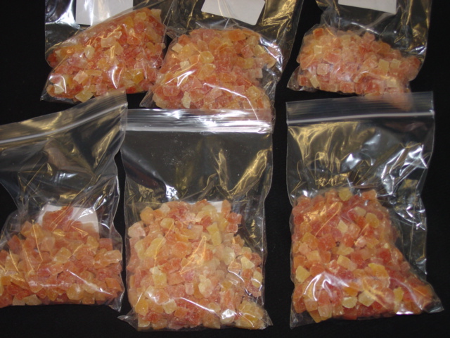 SMALL PIECES OF DICED PAPAYA THAT HAS BEEN DEHYDRATED AND HAD SUGAR ADDED THROUGH A PROCESS WHEREBY PIECES OF FRUIT ARE SUBJECTED TO A PROLONGED SOAKING IN A CONCENTRATED SUGAR AND CITRIC ACID SYRUP THEN DRIED IN AN AIR TUNNEL FOR THREE DAYS. PIECES NO NOT EXCEED ONE CENTIMETER BY ONE CENTIMETER. FOR INCLUSION IN BREAKFAST CEREAL, FRUIT AND NUT MIXES AND THE LIKE. PACKAGED IN 4X5 KG NET HEAT SEALED POLYLINERS IN CORRUGATED CARDBOARD OUTERS.