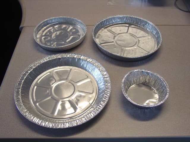 ALUMINIUM FOIL COOKING  PIE BASES, FLAN BASES AND PUDDING BASINS MEASURING APPROXIMATELY  22.5 CM DIAMETER X 2 CM DEEP, 20.5 CM DIAMETER X 2.5 CM DEEP, 16 CM DIAMETER X 2 CM DEEP  AND 11 CM DIAMETER X 3 CM DEEP.
